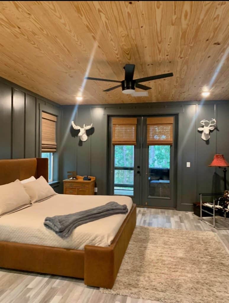 Inside of the master bedroom of a custom home build by JC Homes & Development on the rural coast of the Florida panhande with wood ceilings