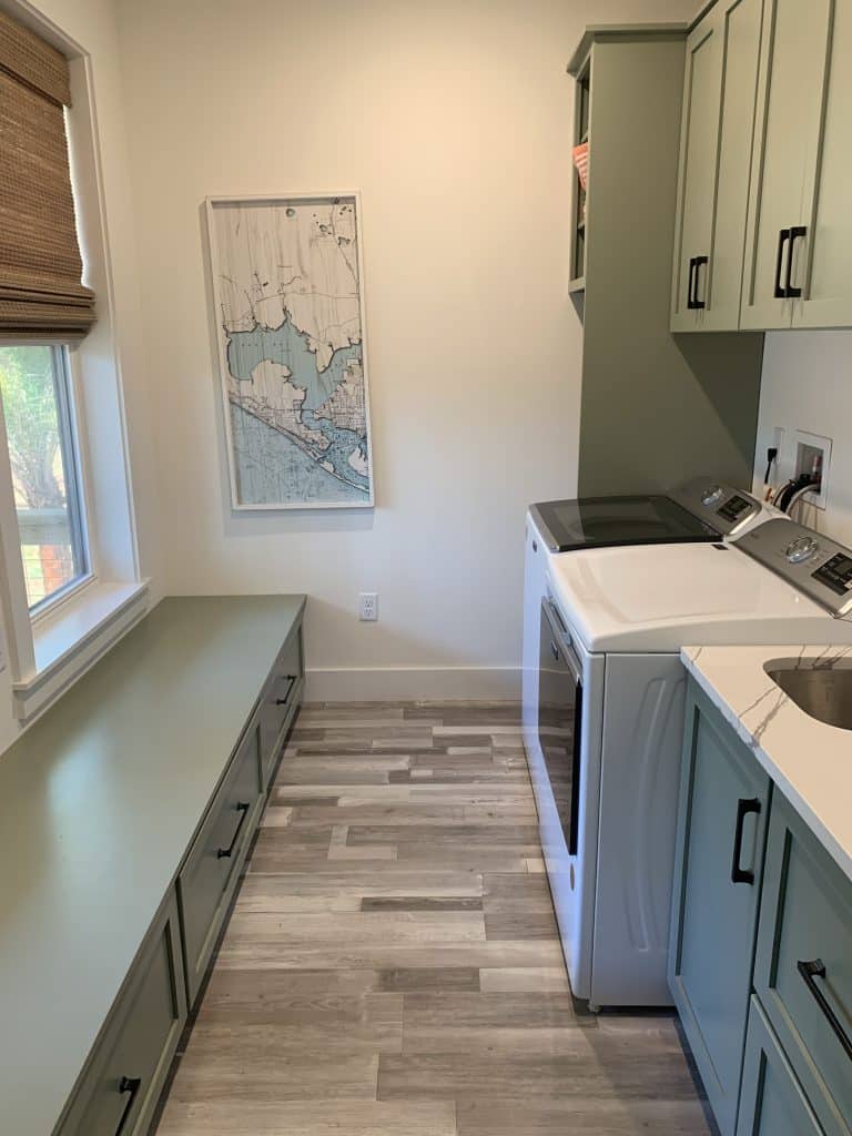 Inside of the laundry room of a custom home build by JC Homes & Development on the rural coast of the Florida panhande with new cabinets & countertops