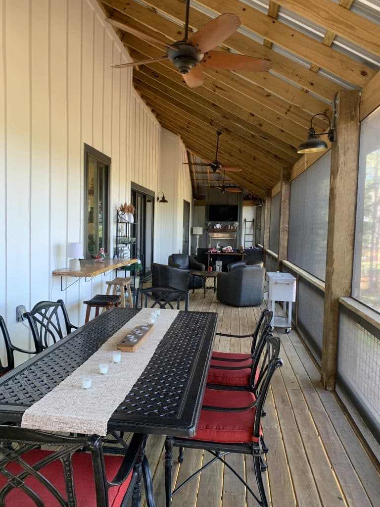 Inside of a custom home build by JC Homes & Development on the rural coast of the Florida panhande with open wood ceiling and screened in porch