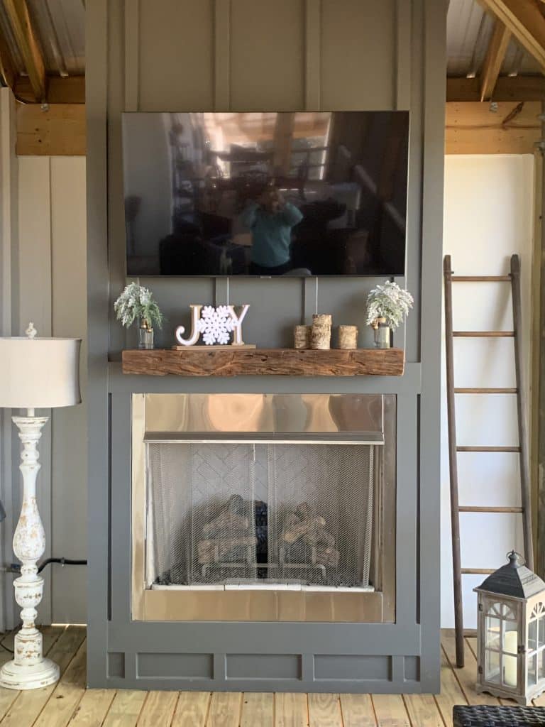 Inside of a custom home build by JC Homes & Development on the rural coast of the Florida panhande with new fire place on a screened in porch